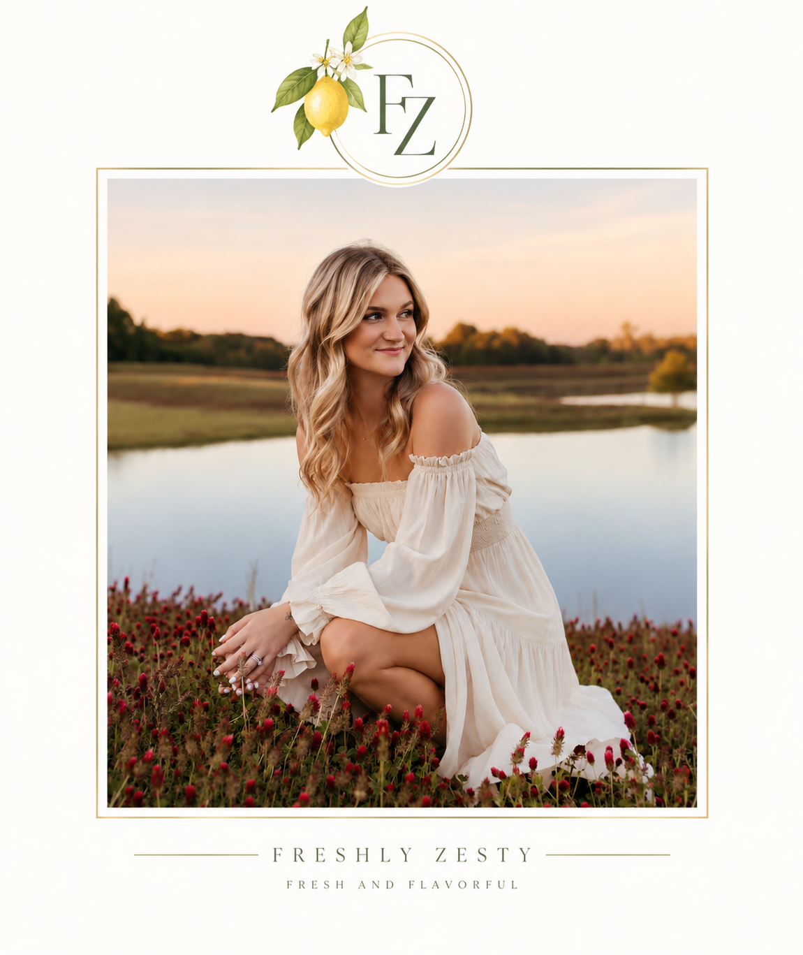 Ashley from Freshly Zesty sitting in a field of red wildflowers beside a peaceful lake at golden hour, wearing a flowing ivory dress, framed with an elegant gold border and Freshly Zesty lemon logo.